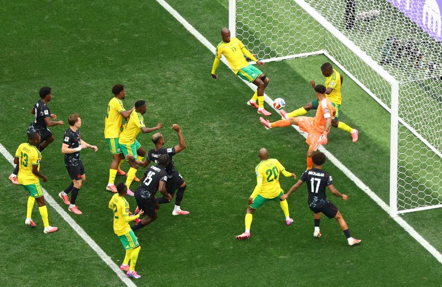 Aubrey Modiba clears the ball off the goal line for South Africa late in the first half.
