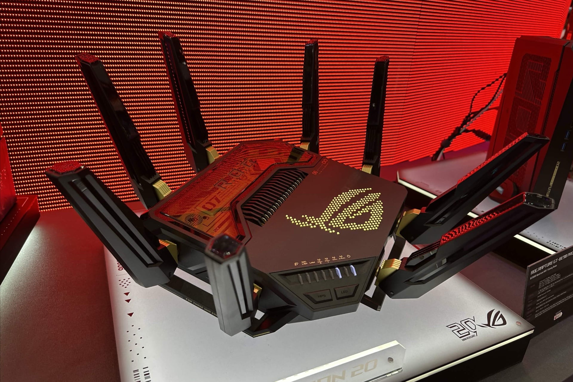 The ROG Rapture BE-98 Pro Edition 20, photographed under red environmental lighting.
