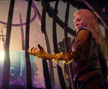 The Cosmic Cube from God of War Laufey gestures with a glowing hand against a mystical background, captured on PS5 Pro.