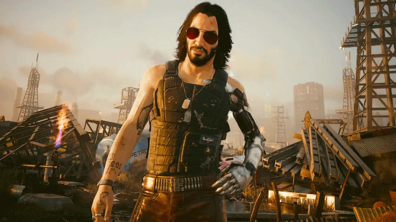 Johnny Silverhand speaks to V in a junkyard in Cyberpunk 2077