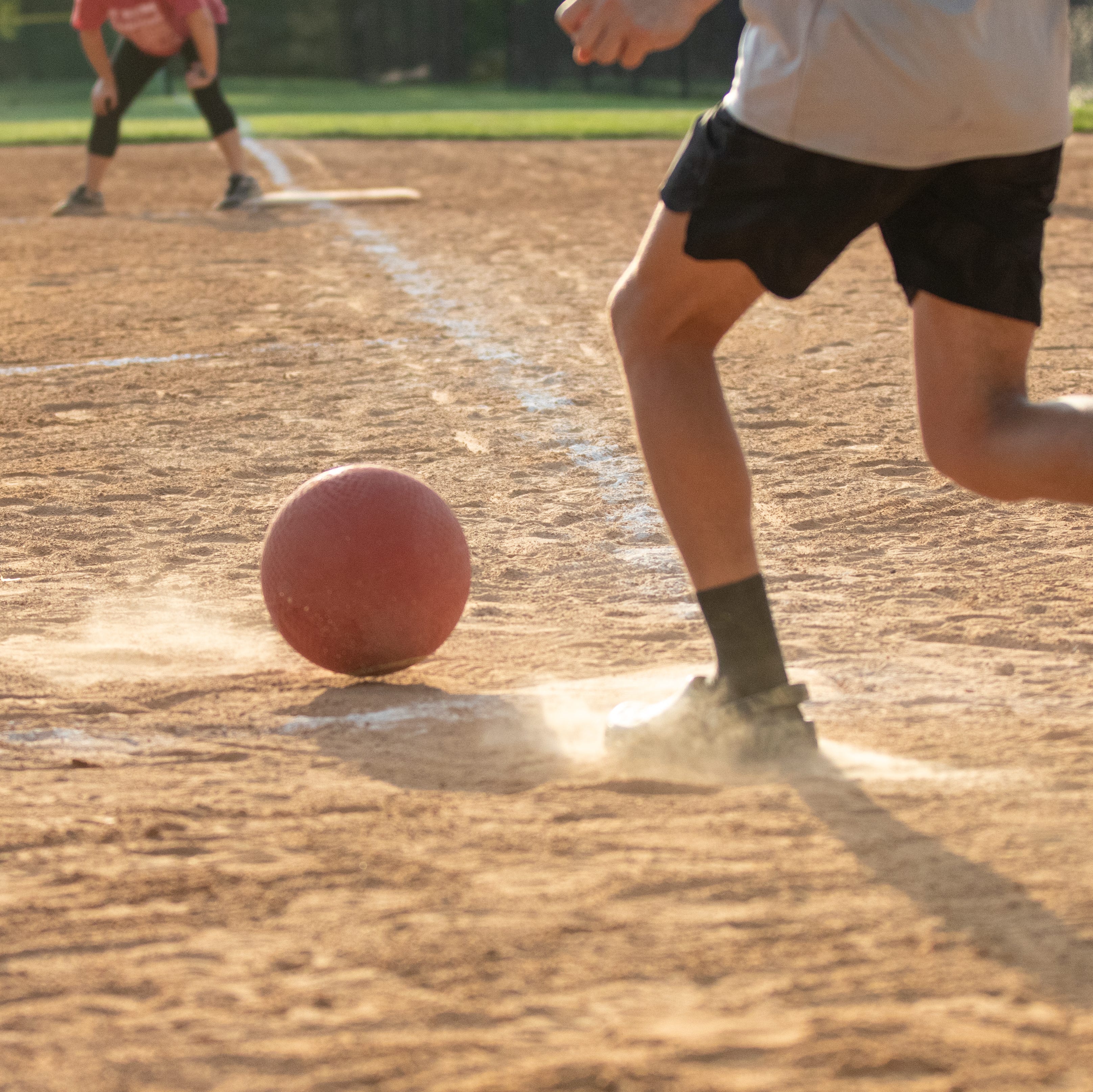 Adult man Playing Kickball
