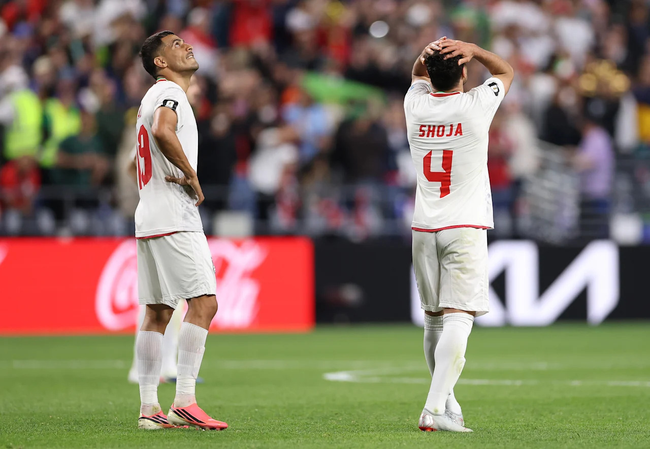 SEATTLE, WASHINGTON - JUNE 26: Ali Nemati #19 and Shoja Khalilzadeh #4 of IR Iran react after the 1-1 draw during the FIFA World Cup 2026 Group G match between Egypt and IR Iran at Seattle Stadium on June 26, 2026 in Seattle, Washington. (Photo by Richard Heathcote/Getty Images)