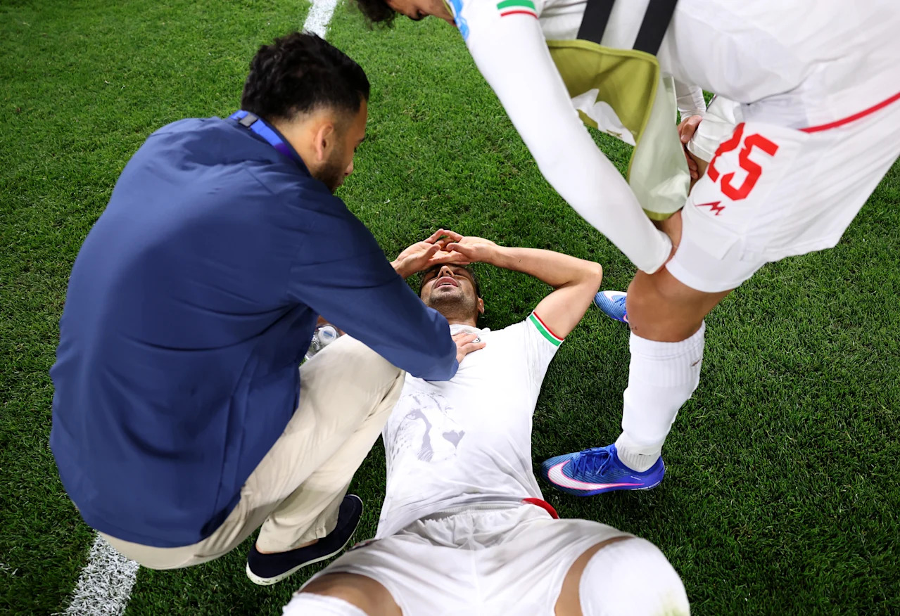 SEATTLE, WASHINGTON - JUNE 26: Shoja Khalilzadeh #4 of IR Iran reacts with teammates after the 1-1 draw during the FIFA World Cup 2026 Group G match between Egypt and IR Iran at Seattle Stadium on June 26, 2026 in Seattle, Washington. (Photo by Alex Livesey - FIFA/FIFA via Getty Images)
