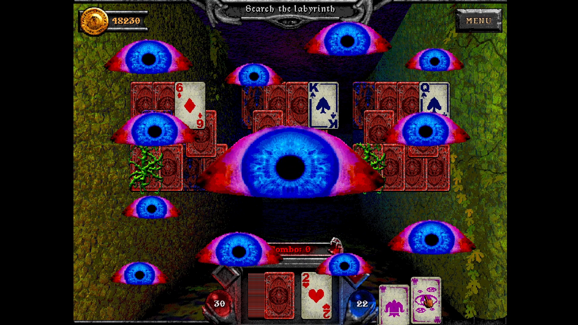 A screenshot from Forbidden Solitaire, in which playing cards a spread across the screen but so are reddened eyes with alarmingly blue irises