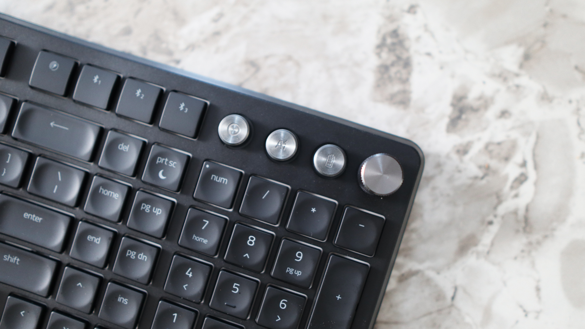 Razer Pro Type Ergo ergonomic keyboard on marble surface