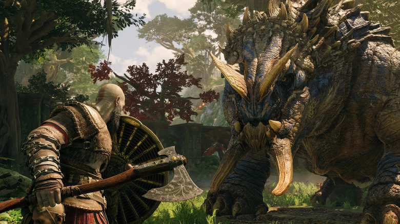 Kratos raises his shield at a horned monster in God of War Ragnarök