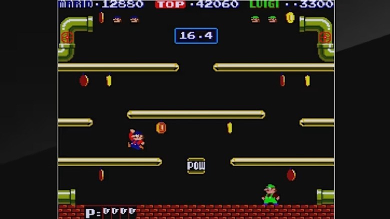 Mario and Luigi grab coins around platforms in Mario Bros.