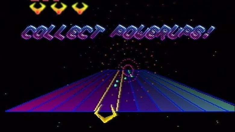 A spaceship goes down lit lanes in space in Tempest 2000