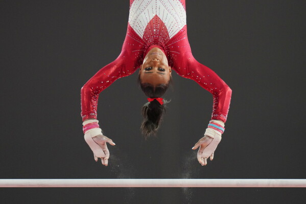 England's Shantae-Eve Amankwaah competes on the uneven bars during the women's team final and individual qualification of Artistic Gymnastics at the Commonwealth Games in Glasgow, Scotland, Saturday, July 25, 2026. (AP Photo/Kin Cheung)