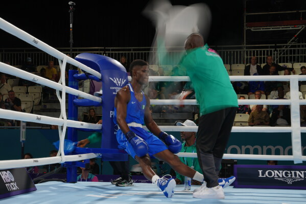Nigeria's Ayomide Foly Hassan, competes during the Men's 70kg round of 32 boxing bout against Lesotho's Refiloe Thai, during the Commonwealth Games in Glasgow, Scotland, Friday, July 24, 2026. (AP Photo/Kin Cheung)