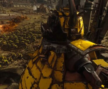 An ork stompa marches across a battlefield, a regiment of orks beside it