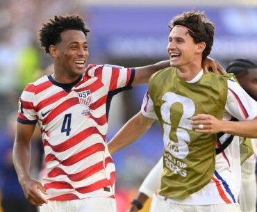 Tyler Adams (left) and Medford's Brenden Aaronson celebrate at the end of the U.S.-Bosnia game.