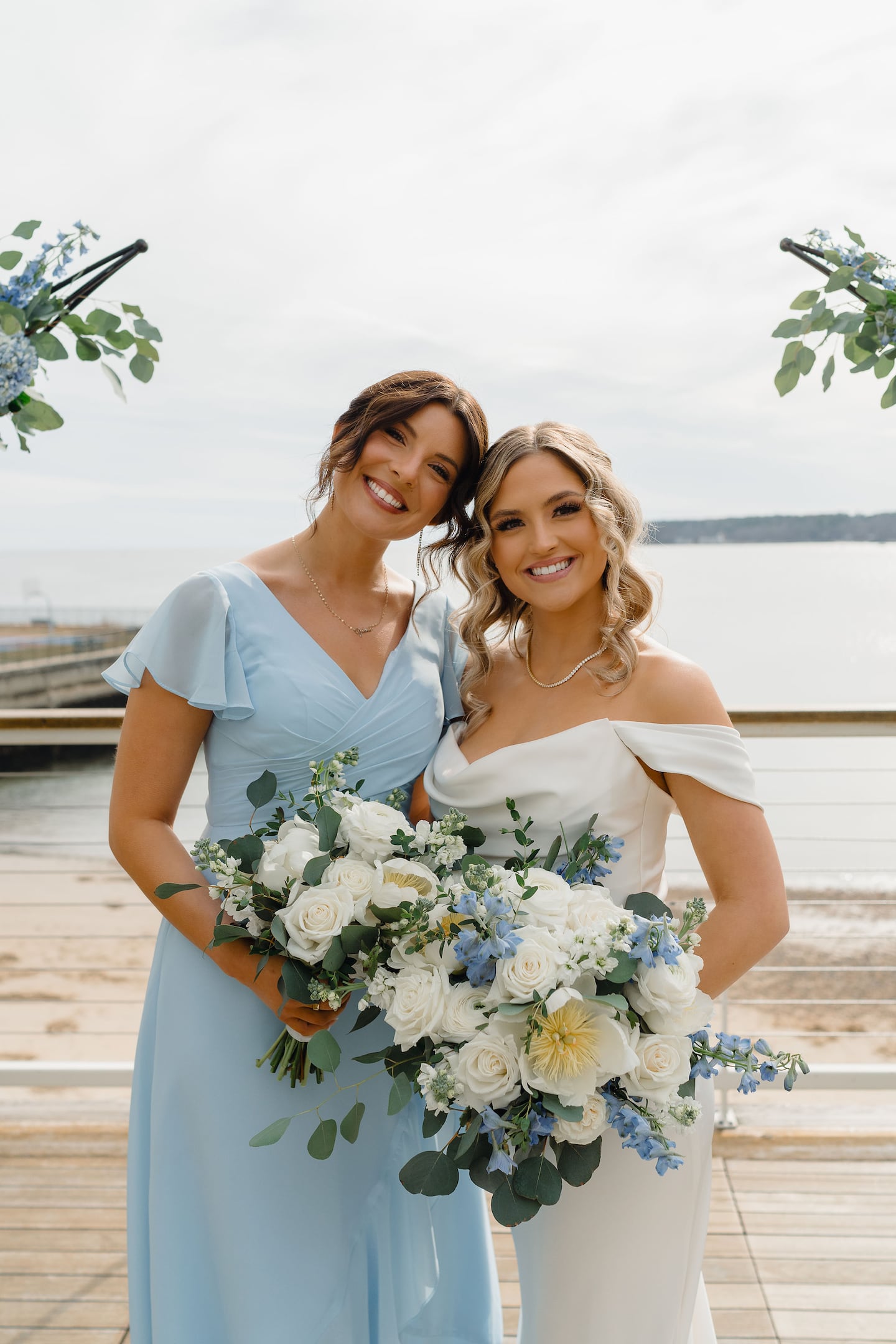 Elena and Kelsey, who served as her matron of honor. The bridal party -- her three bridesmaids were her three sisters-in-law -- wore light blue, to coordinate with the hydrangeas. 