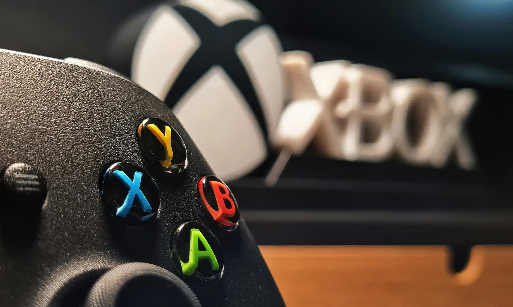 Xbox Controller with Xbox Logo in background