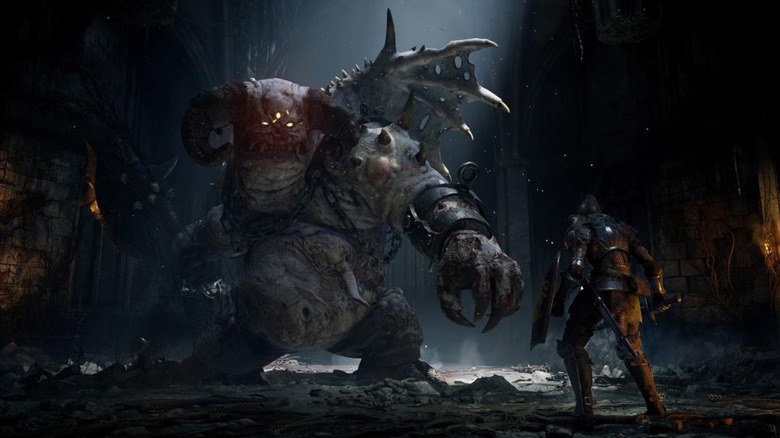 The player fighting Vanguard demon in Demon's Souls (2020)
