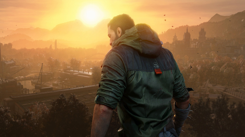 Kyle Crane surveys a factory at sunset in 