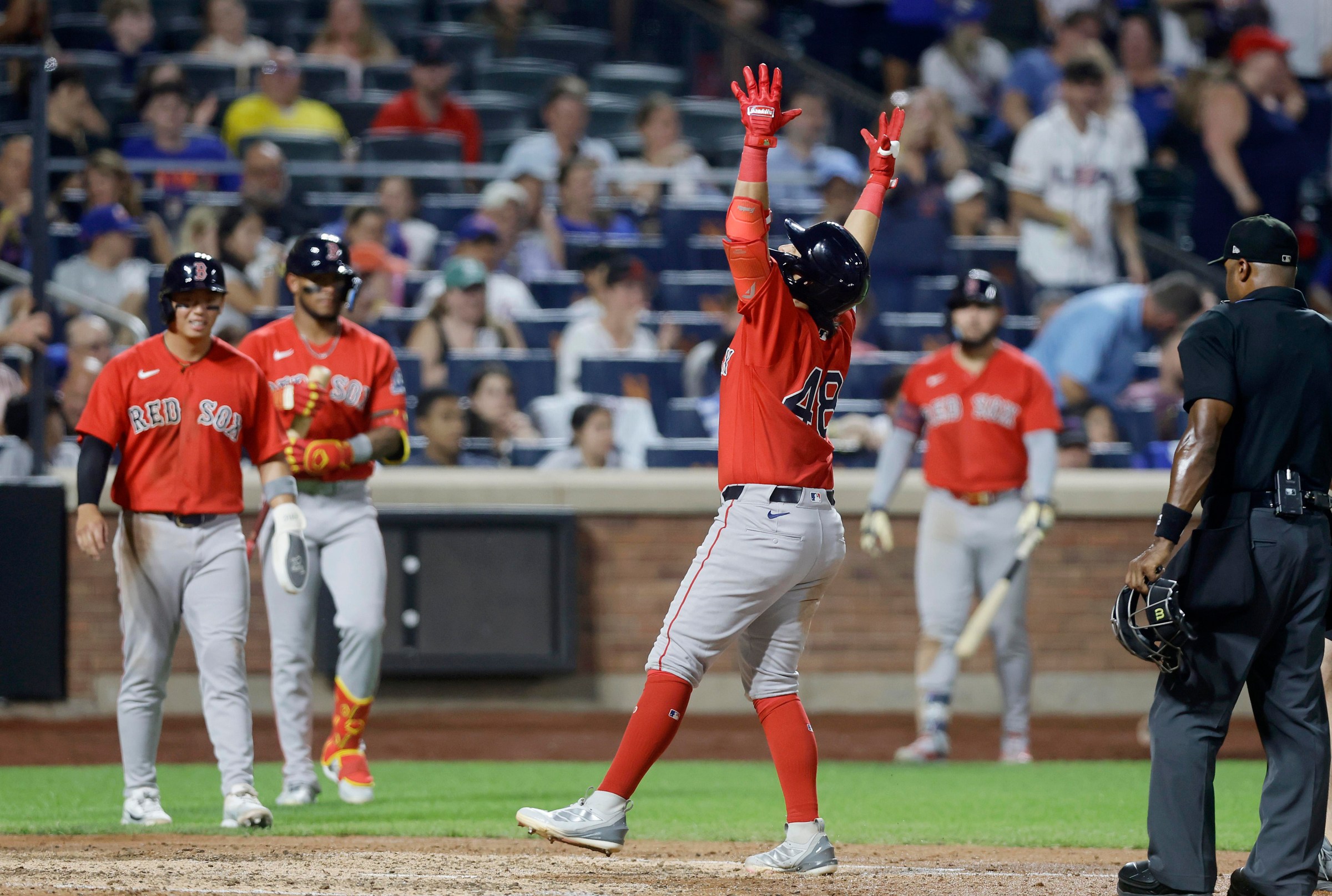 NEW YORK, NEW YORK - JULY 10: Anthony Seigler #48 of the Boston Red Sox celebrates at home plate after his seventh inning two run home run against the New York Mets with teammates Tsung-Che Cheng #39 (L) and Ceddanne Rafaela #3 (2nd L) at Citi Field on July 10, 2026 in New York City. (Photo by Jim McIsaac/Getty Images)