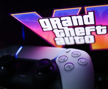 GTA VI logo from the trailer displayed on a laptop screen and PlayStation DualSense controller. (Photo by Jakub Porzycki/NurPhoto via Getty Images)