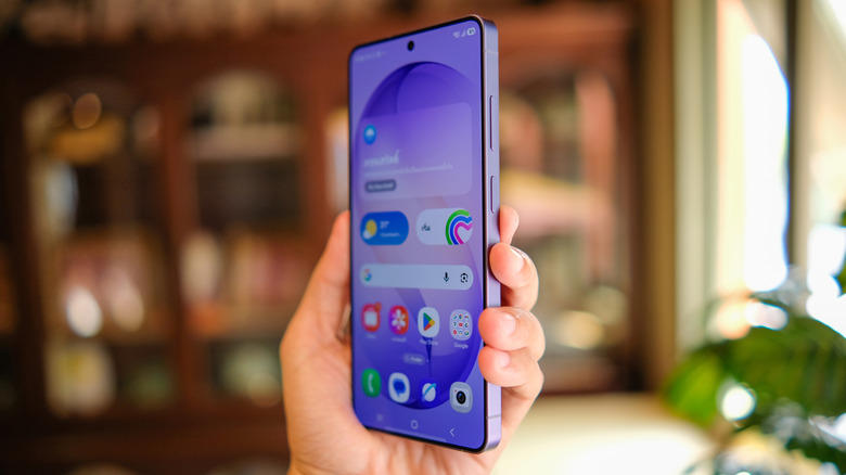 a person holding up a Samsung Galaxy S26 Ultra showing the home screen