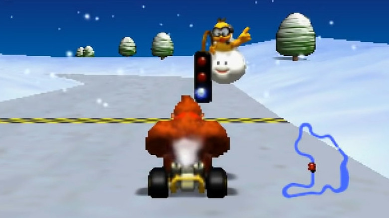 Donkey Kong sits in his kart at the starting line in Mario Kart 64