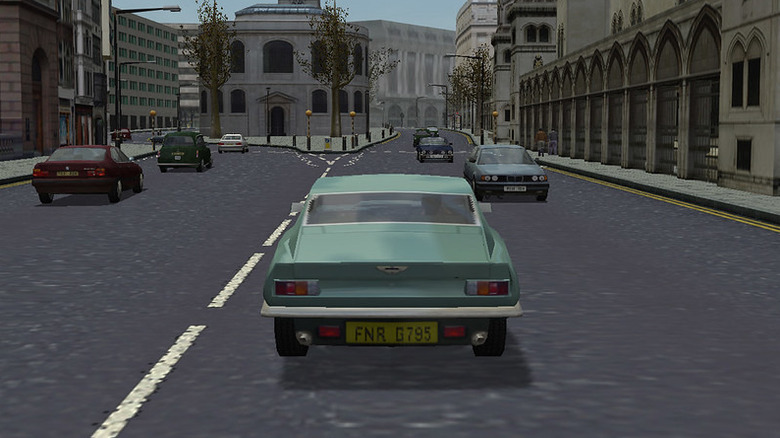 A green car drives through London in 