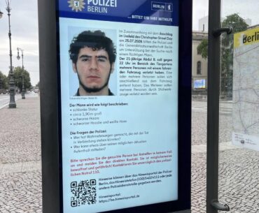 Berlin bus stops using screens to display wanted posters.