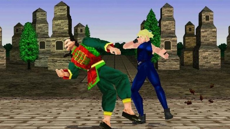 Sarah hits Lau in Virtua Fighter 2