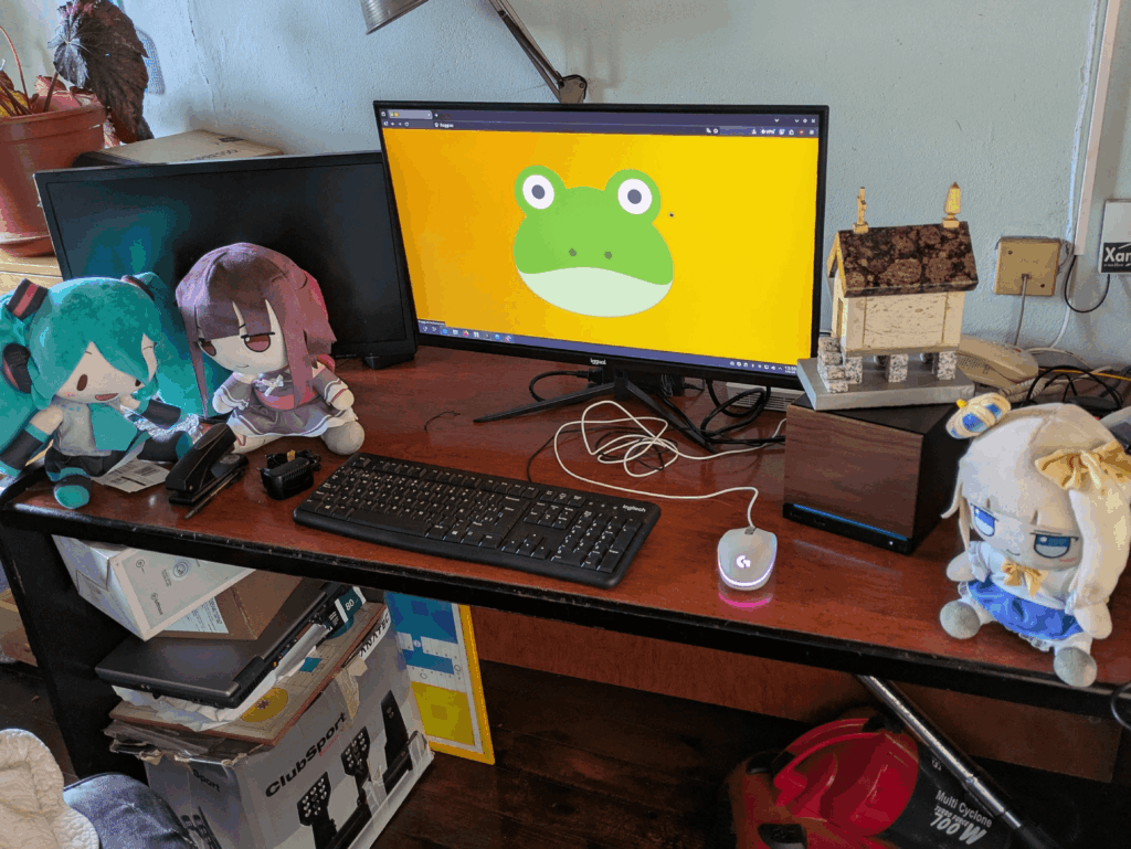 My temporary summer vacation workstation (left monitor is off because it's VGA and I have yet to buy a cable)