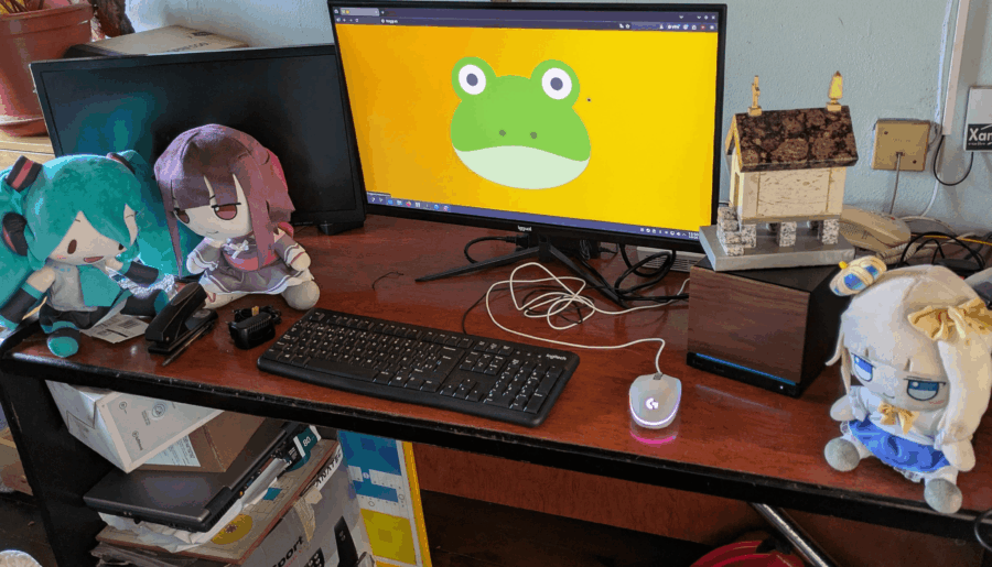 My temporary summer vacation workstation (left monitor is off because it’s VGA and I have yet to buy a cable)