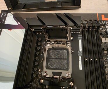 New ROG Crosshair X870E Hero, no CPU ever installed. AM5 socket has persistent shiny/dark patches visible by eye from multiple angles. Do these contacts look normal or bent/damaged?