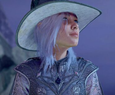 A sorcerer character in Baldur's Gate 3 looking to the left and smiling