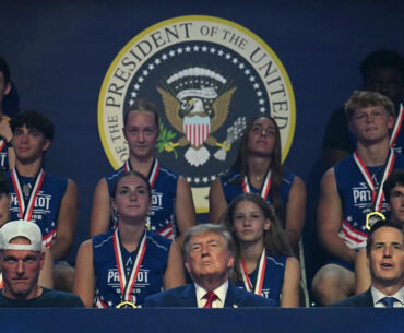 Pat McAfee joins Donald Trump during 2026 Patriot Games entrance, sits next to him during event