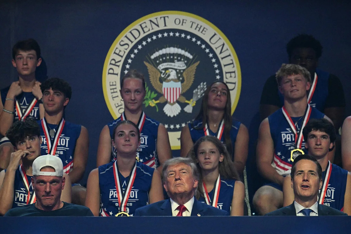 Pat McAfee joins Donald Trump during 2026 Patriot Games entrance, sits next to him during event Pat McAfee joins Donald Trump during 2026 Patriot Games entrance, sits next to him during event