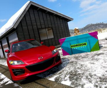 Forza Horizon 6 hokubu winter treasure hunt red car posing next to treasure chest in the snow