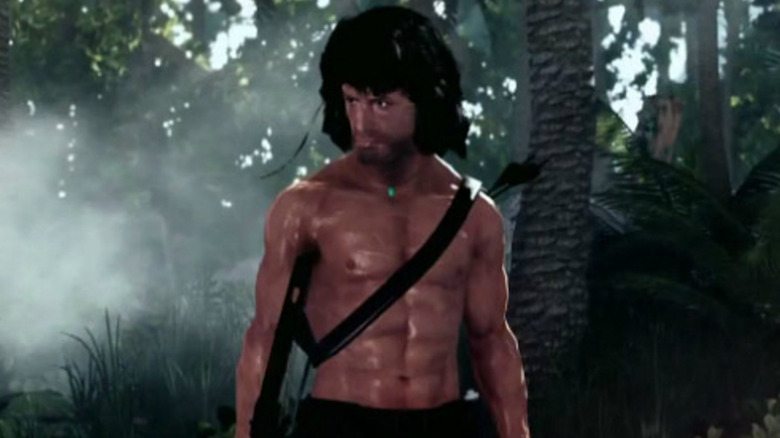 A poorly rendered John Rambo stands in the jungle in Rambo: The Video Game